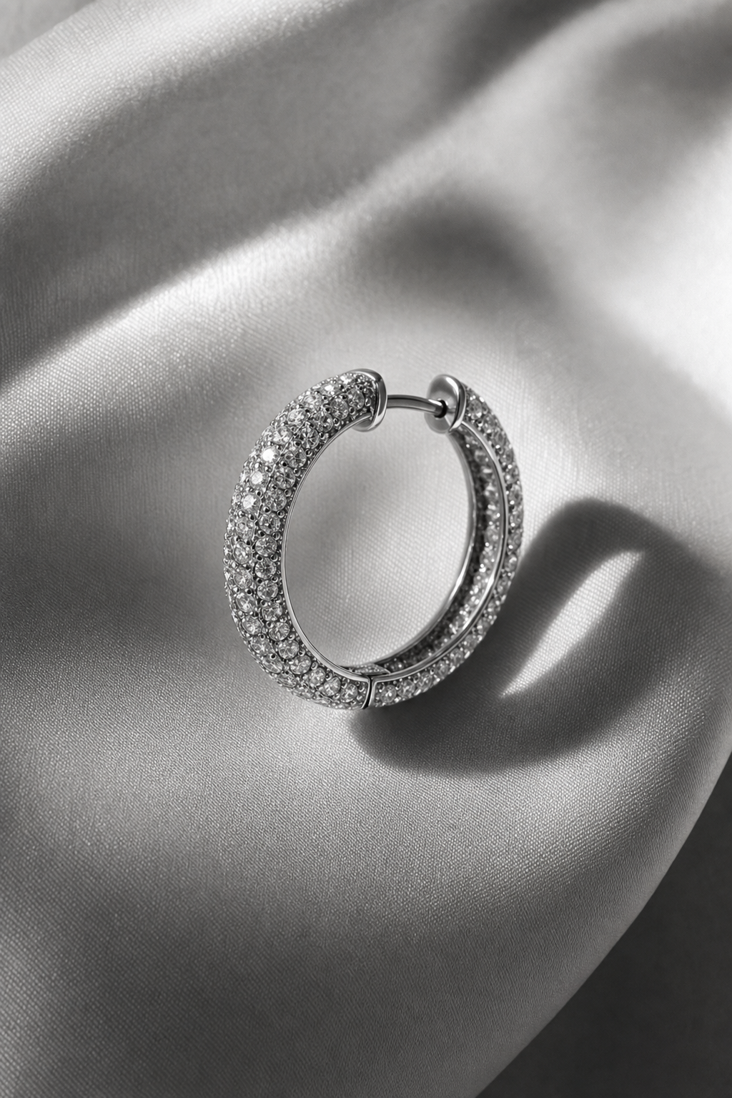 black and white editorial portrait — pavé diamond hoop earrings